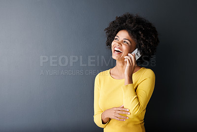 Buy stock photo Black woman, laughing and happy phone call, communication or connection in studio background. African, face or person in funny mobile conversation with joke or listening to contact talking with humor