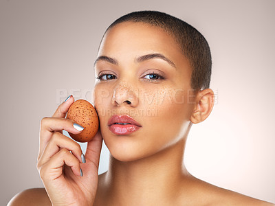 Buy stock photo Skincare, beauty and portrait of woman with egg in studio for natural, cosmetic and facial treatment. Hydration, health and female model with poultry for face dermatology routine by gray background.