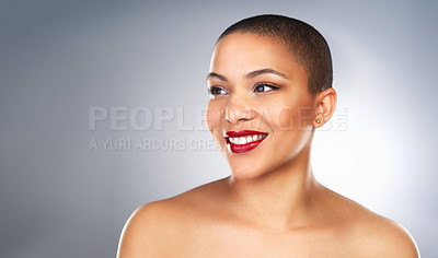 Buy stock photo Studio shot of a beautiful young woman posing with a full face of make-up