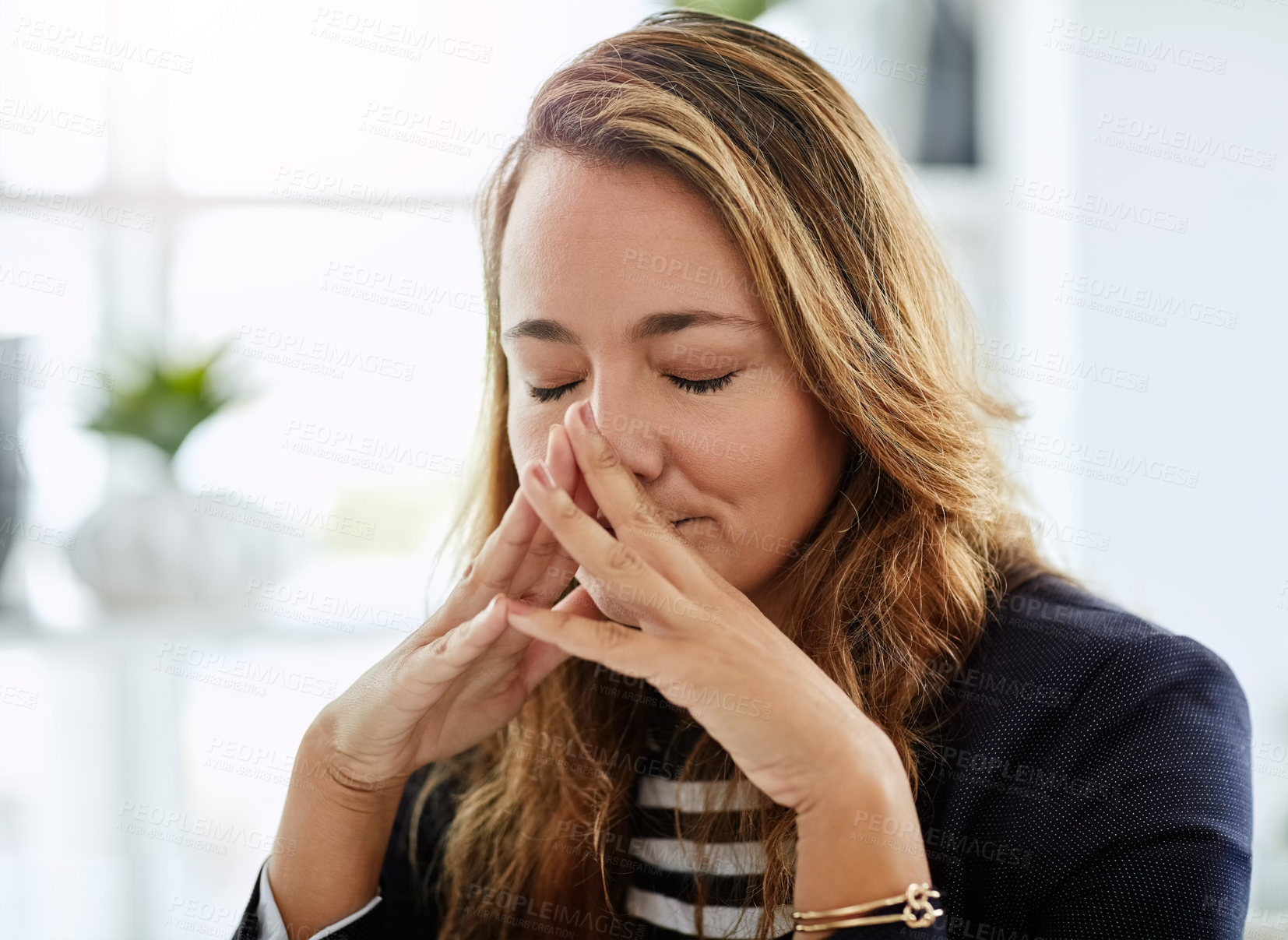 Buy stock photo Shot of an attractive businesswoman looking overly stressed out in her office at work