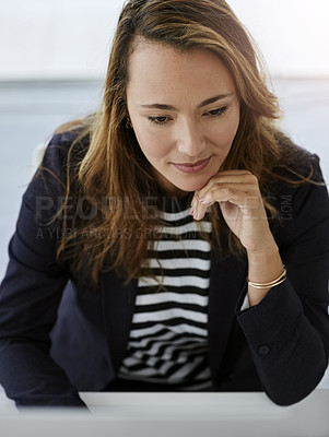 Buy stock photo High angle shot of an attractive businesswoman working on a computer in her office