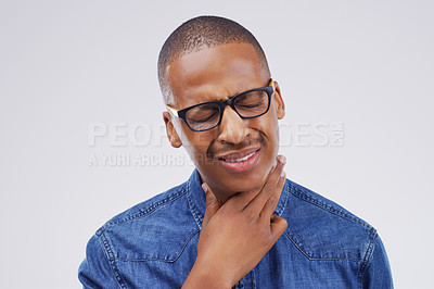 Buy stock photo Black man, sore throat and virus in pain, allergies or bacteria against a white studio background. Sick African male person touching neck from cough, allergy or flu of cold, illness or infection