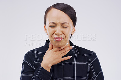 Buy stock photo Studio shot of a young woman suffering with a sore throat against a grey background
