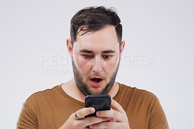 Buy stock photo Man, wow face and smartphone on studio background for reading website with omg expression, social media and online scam. Male person, mobile and surprise by grey backdrop for news website and shocked