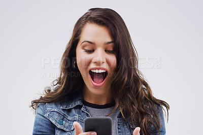 Buy stock photo Woman, surprise and phone for winning, prize or good news against a white studio background. Shocked, surprised or excited female person reading on mobile smartphone of lottery winner in wow or bonus