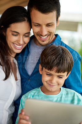 Buy stock photo Family, son and tablet, games or cartoon streaming online with internet, bonding and people relax together. Watch animation film, parents and kid at home with connection, subscription and smile