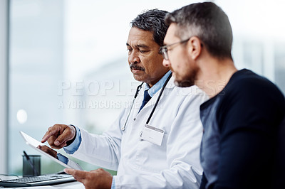 Buy stock photo Healthcare, talking and doctor with a man and tablet for consulting, results and help with health. Planning, medicine and a mature hospital worker speaking to a patient about medical service on tech