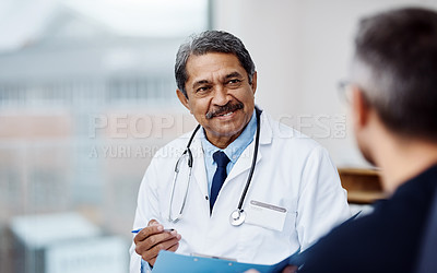 Buy stock photo Healthcare, medical and doctor with a patient in a consultation in his office in the clinic. Professional, conversation and mature male phd worker consulting a man for diagnosis in medicare hospital.