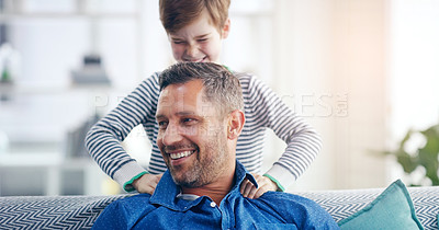 Buy stock photo Love, father and son happy smile in living room of their home with lens flare. Happiness or caring, family and male parent with child playing spending quality time or bonding together on couch