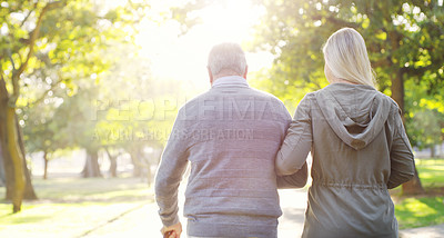 Buy stock photo Senior man, woman and walking outdoor in a park for support, love and care. Back of elderly father with a cane and daughter on walk for a healthy retirement, life insurance and family time in nature