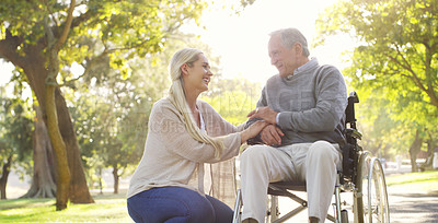 Buy stock photo Happy, talking and man in wheelchair with a woman in nature for care and support. Holding hands, smile and an elderly person with a disability and a daughter with love and conversation in a park