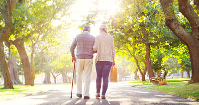 Buy stock photo Senior man, daughter and cane outdoor in a park while walking together for support, love and care. Elderly father and a woman walk for a healthy retirement, life insurance and family time in nature