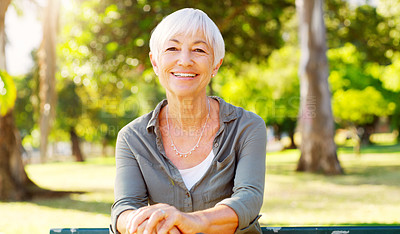 Buy stock photo Smile, portrait and senior woman outdoor in park, garden and nature for wellness and relax on bench in summer. Happy, pension or mature lady in retirement for peace by trees, sunshine and environment