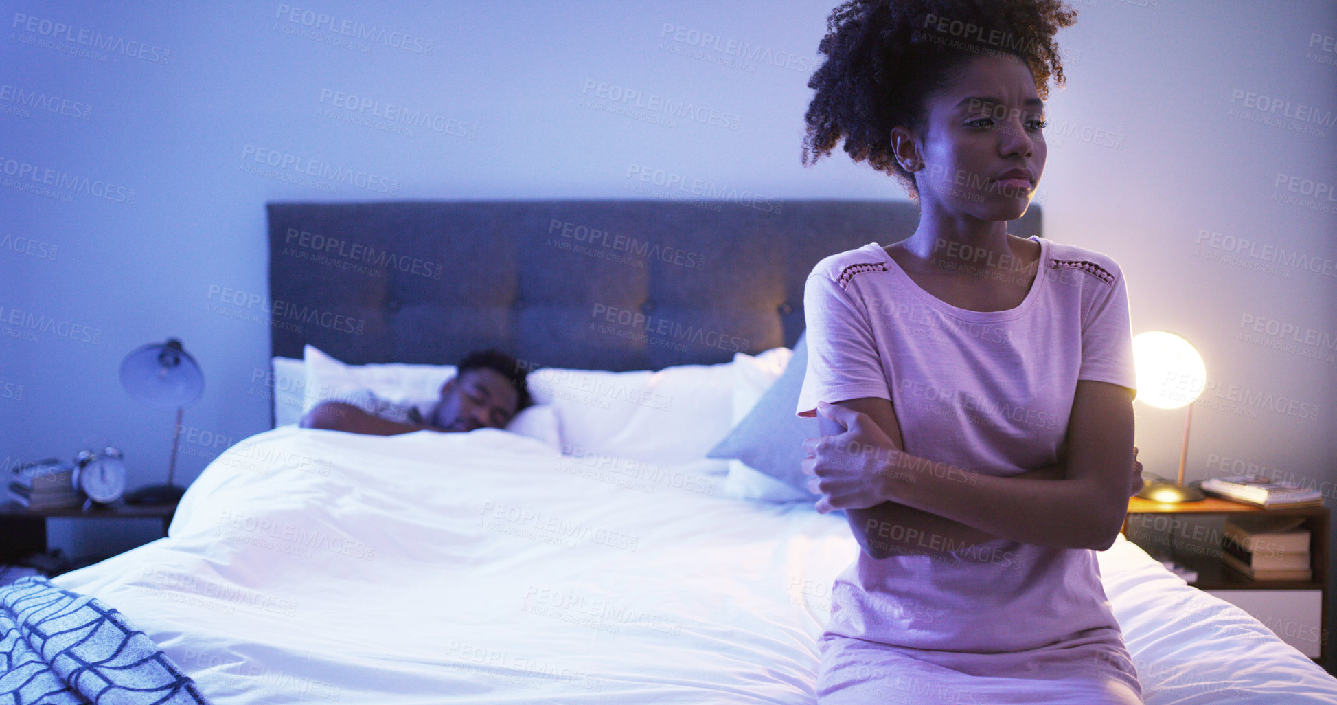 Buy stock photo Black couple, bedroom and night with a woman sad while thinking of divorce, stress or depression. Man sleeping in home bed with partner upset about fight, marriage problem and cheating or infertility