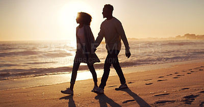 Buy stock photo Couple holding hands, walking on beach at sunset and ocean with silhouette, vacation and travel with mockup space. Love, romance and trust with people in commitment, tropical holiday and sea view