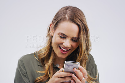 Buy stock photo Phone, laugh and face of woman in studio with smile for social media, internet and online meme. Communication, white background and female person on smartphone for funny website, mobile app and humor