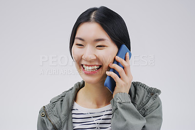 Buy stock photo Happy, phone call and Asian woman talking in studio isolated on a white background. Funny, cellphone and female person speaking, discussion or communication, conversation and networking with contact.