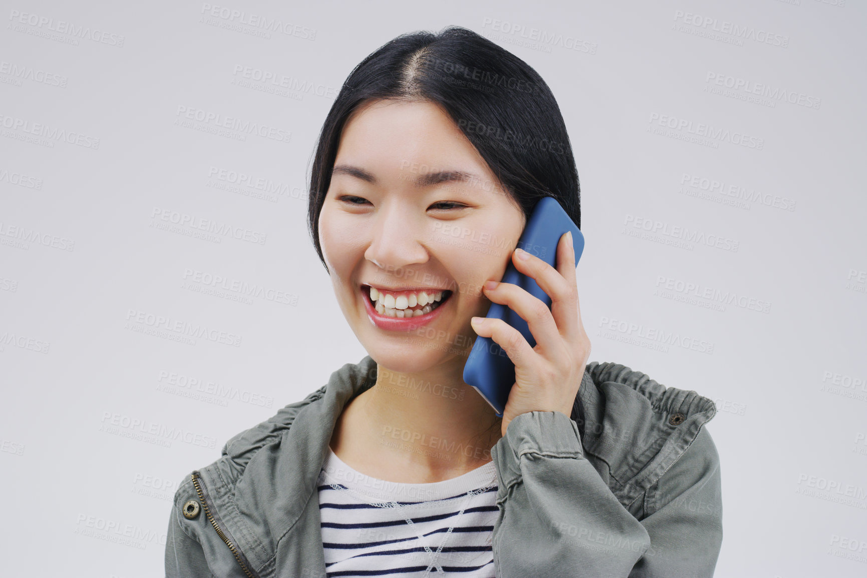 Buy stock photo Happy, phone call and Asian woman talking in studio isolated on a white background. Funny, cellphone and female person speaking, discussion or communication, conversation and networking with contact.