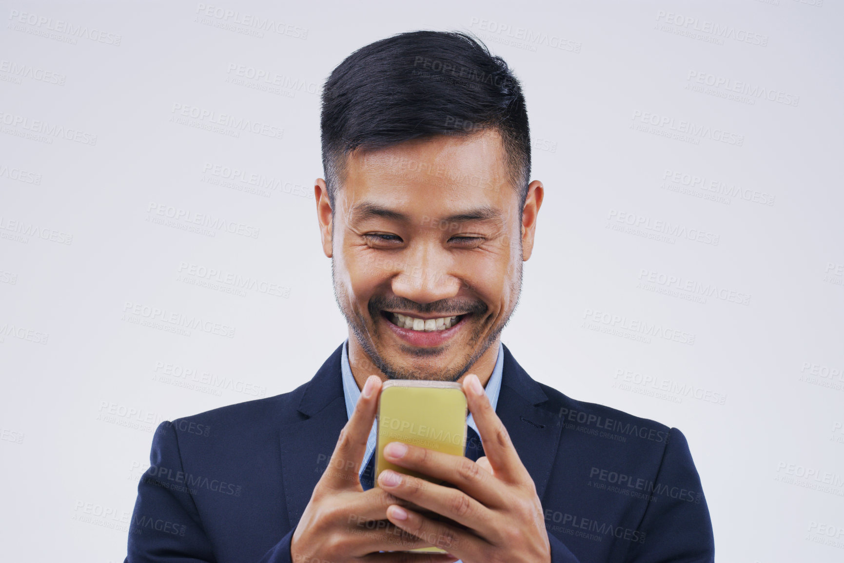 Buy stock photo Smile, phone and Asian business man in studio isolated on white background. Happy, cellphone and male person typing for email, web scroll or browsing online, social media or internet app for texting.