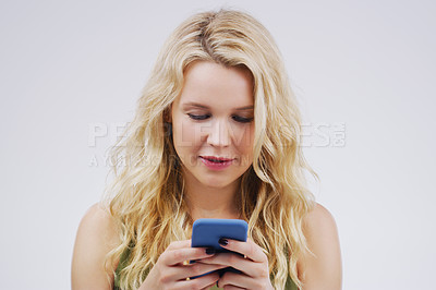 Buy stock photo Phone, social media and woman in studio typing message, browse internet and online chat. Communication mockup, white background and female person on smartphone for website, mobile app and networking