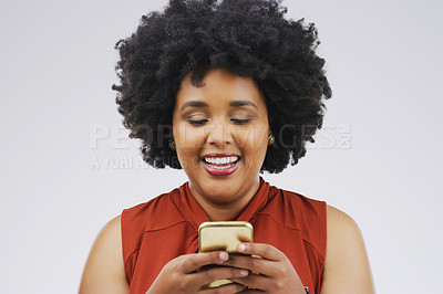 Buy stock photo Smile, mockup and African woman with a smartphone, typing and communication against a white studio background. Female person, model and girl with a cellphone, mobile app and connection with happiness