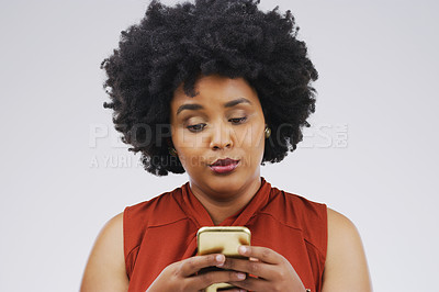 Buy stock photo Social media, girl and black woman with a smartphone, attitude and communication on a white studio background. Female person, doubt or model with a cellphone, mobile app and online reading or contact