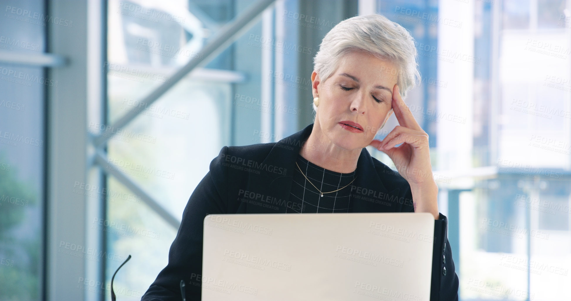 Buy stock photo Burnout, laptop and stress with business woman in office for management deadline or report. Computer, anxiety or depression and mature boss, CEO or manager with tension headache in workplace