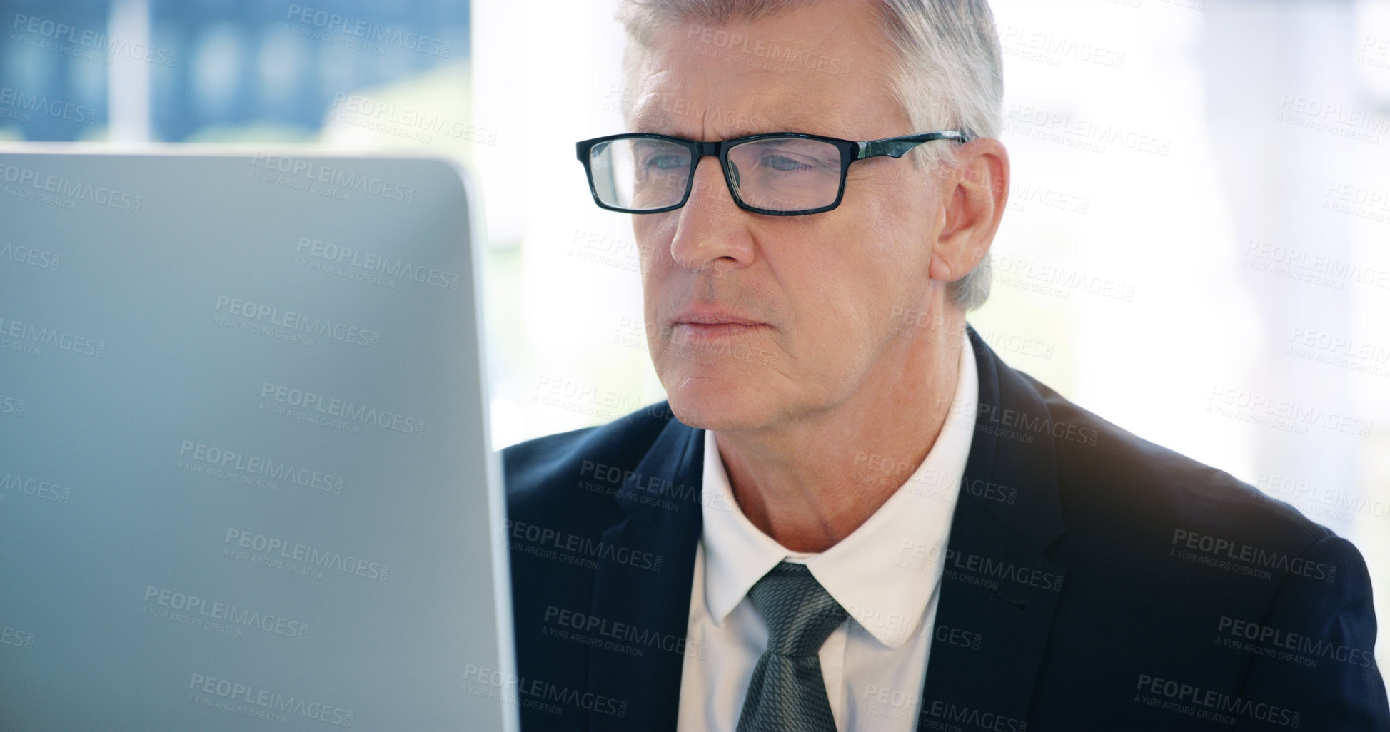 Buy stock photo Mature man, corporate and monitor by desk for web connection, executive job and reading email. Expertise, technology and face of senior ceo in office with business, checking schedule and online work