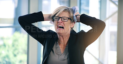 Buy stock photo Shot of a mature businesswoman looking stressed out in an office
