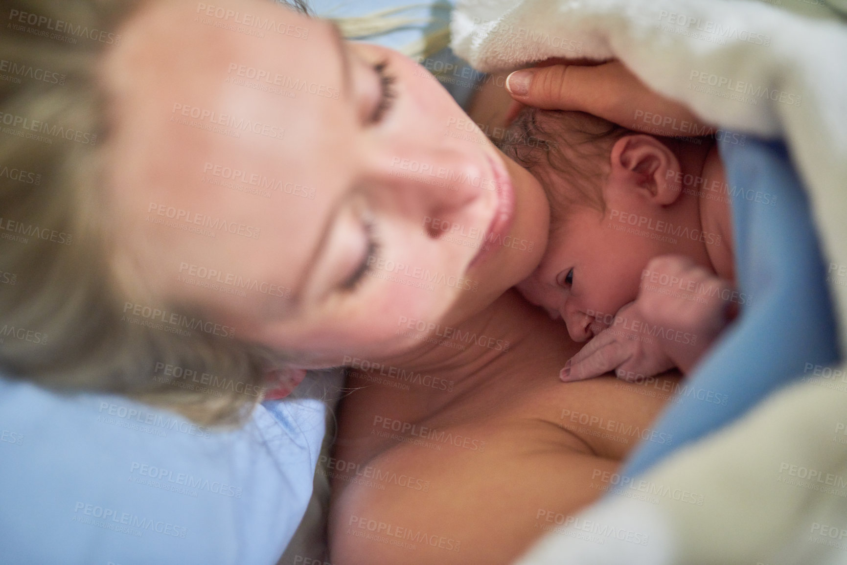 Buy stock photo Shot of a beautiful young mother lying in bed with her newly born baby girl in the hospital