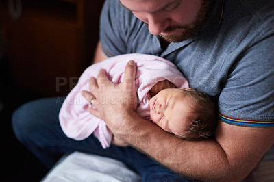 Buy stock photo Shot of an adorable infant girl sleeping in her father's arms in hospital