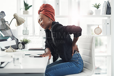 Buy stock photo African woman, back pain and stress at office, startup and injury with posture, health and muscle fatigue. Person, strain or ache in spine, frustrated and burnout in workplace at creative agency