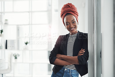 Buy stock photo Cropped portrait of an attractive young businesswoman standing with her arms crossed in her office