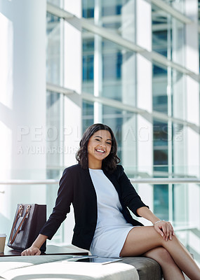 Buy stock photo Cropped portrait of an attractive young businesswoman smiling while sitting in a waiting room