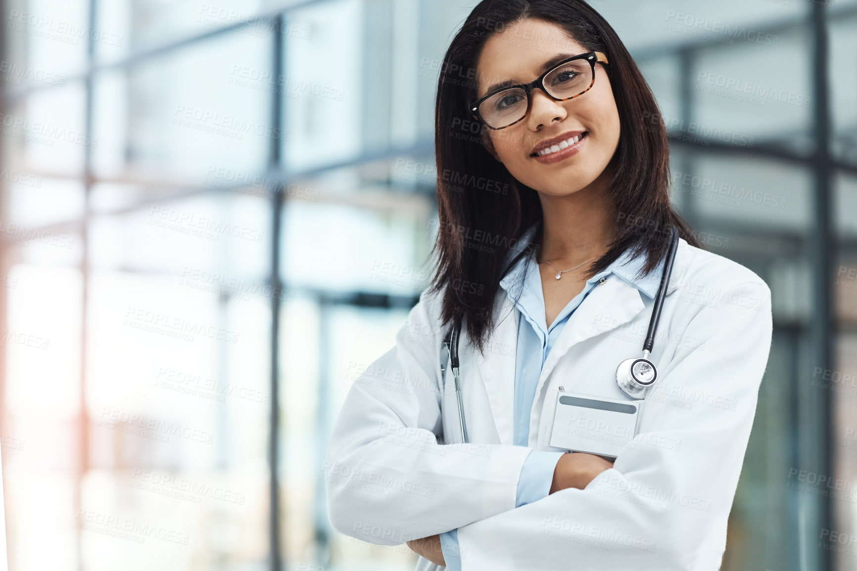 Buy stock photo Portrait of a confident young doctor working in a modern hospital