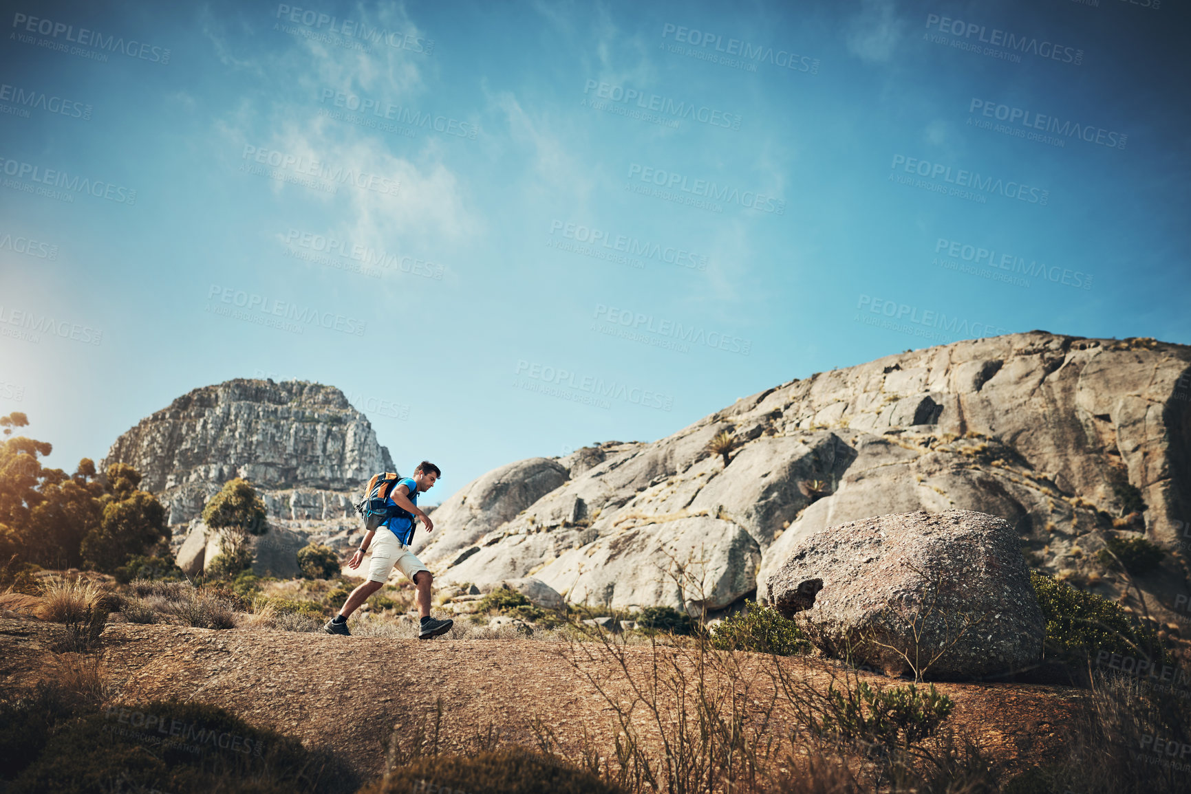 Buy stock photo Hiker, man and nature for travel, walking and person in mountains, fitness and sports of mockup. Trekking, healthy and adventure with supplies in bag, rocks and explore in forest and active in space