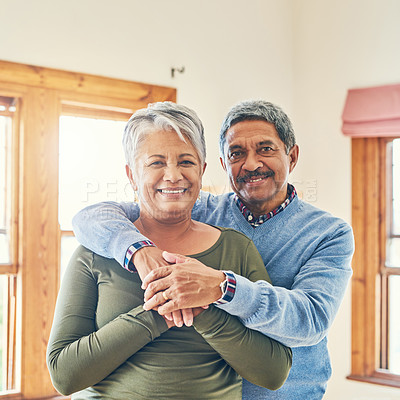 Buy stock photo Portrait of an affectionate senior couple posing together in their home