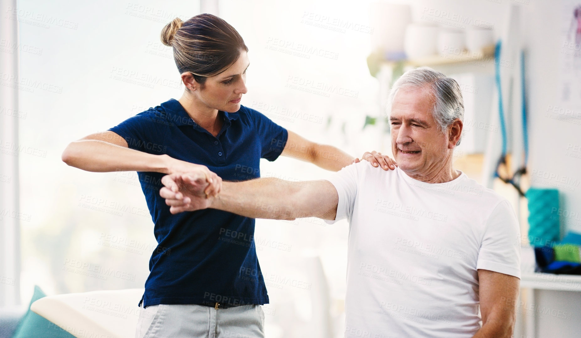 Buy stock photo Physiotherapist, senior man and patient stretching, health and wellness in office. Healthcare, mature male client and female medical professional help with injury, exercise and physiotherapy fitness.