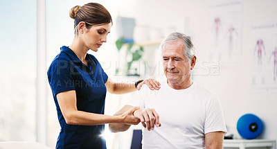 Buy stock photo Nurse, patient and physical therapy for elderly care, medical or healthcare support at the clinic. Woman physiotherapist or chiropractor helping mature man in physiotherapy or arm stretching