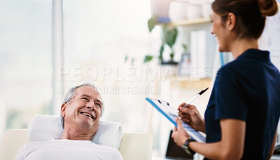 Buy stock photo Clipboard, nurse and consultation with old man in physiotherapy bed for treatment, health advice or assessment. Wellness, checklist and rehabilitation of senior patient in hospital after accident.
