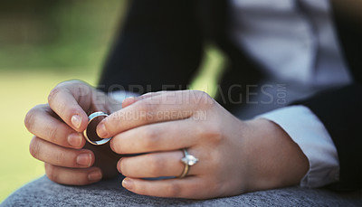 Buy stock photo Hands, wedding ring and divorce with depression, grief or loss with life crisis and mistake. Regret, sad and marriage fail with person outdoor, mental health or psychology with break up and trauma