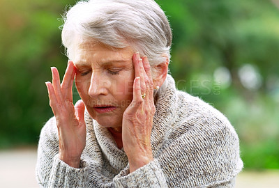 Buy stock photo Senior woman, headache and pain in garden or park for retirement, pension and stress thinking in New York. Grandmother, Alzheimer and anxiety in nature for mental health, tension and dementia  