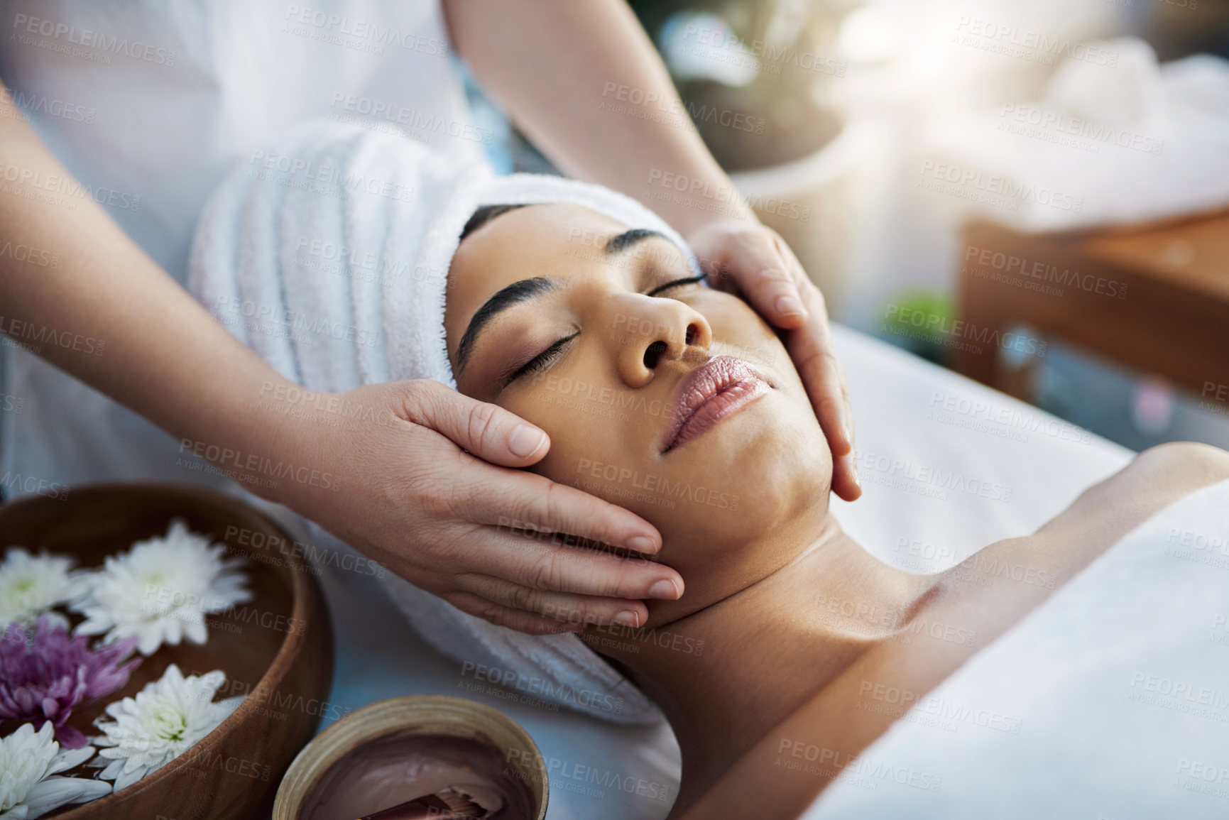 Buy stock photo Woman, hands and face massage for skincare, relax or beauty spa treatment on bed at resort. Calm female relaxing with eyes closed or resting for physical therapy, healthy wellness or cosmetic facial