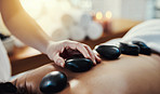 Hot stone massage are a helpful way to ease muscle tension
