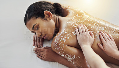 Buy stock photo Shot of a young woman getting an exfoliating massage at a spa