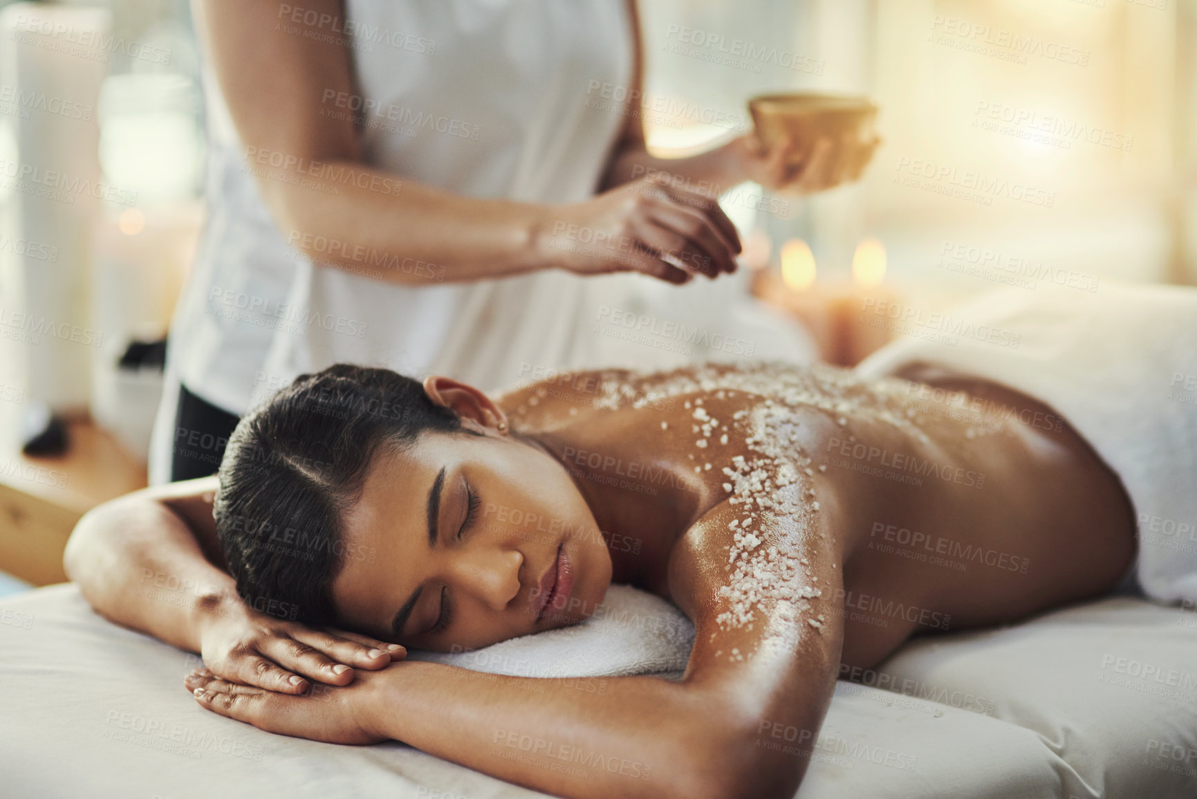 Buy stock photo Woman, sleeping and relax in salt scrub massage at spa for skincare, exfoliation or body treatment. Calm female asleep or resting in relaxation for back therapy, health or zen with masseuse at salon