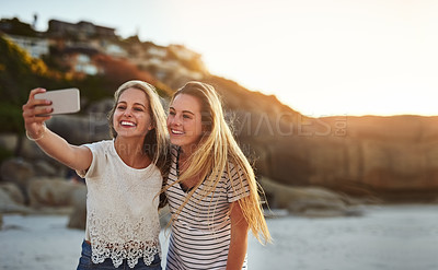 Buy stock photo Selfie, women or happy on beach for travel, holiday or making memories at reunion. Friends, vacation or smile for photography with wind, hug or excited at ocean for relationship development in Miami