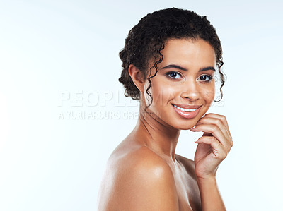 Buy stock photo Portrait of an attractive young woman posing against a white background
