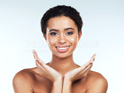 Buy stock photo Portrait of an attractive young woman posing against a white background