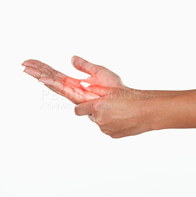 Buy stock photo Studio shot of an unrecognizable woman holding her hand in pain against a white background